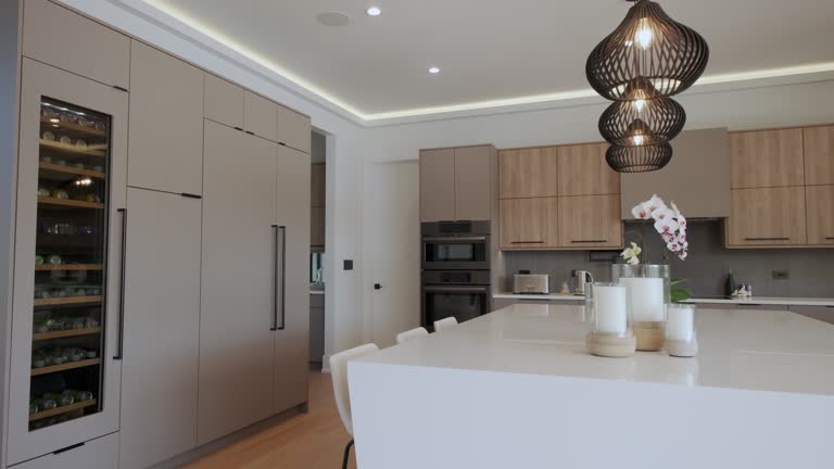Luxury kitchen with white island and pendant light